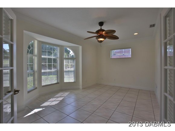 117 Inlet Harbor Road Ponce Inlet, FL 32127 - Photo 12 of 24 a view of an empty room with a window
