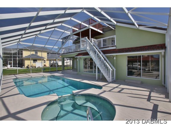 117 Inlet Harbor Road Ponce Inlet, FL 32127 - Photo 15 of 24 a view of a house with backyard porch and sitting area