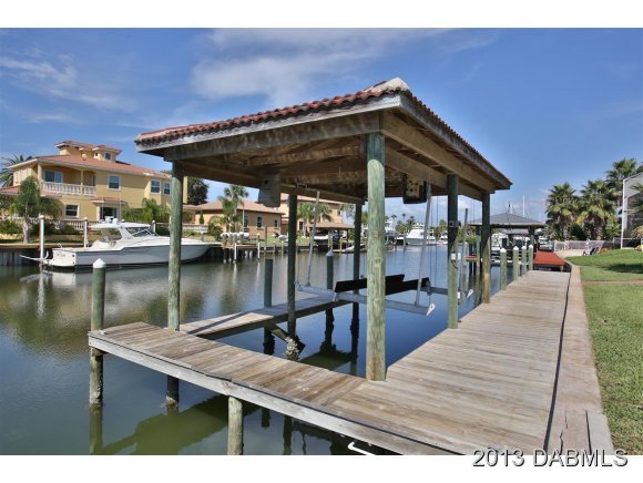 117 Inlet Harbor Road Ponce Inlet, FL 32127 - Photo 16 of 24 a view of a swimming pool with outdoor seating