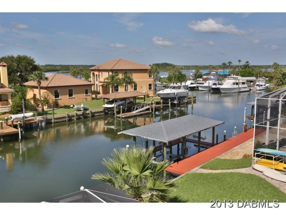117 Inlet Harbor Road Ponce Inlet, FL 32127 - Photo 18 of 24 a view of a house with pool and a yard