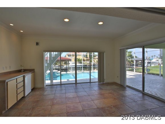 117 Inlet Harbor Road Ponce Inlet, FL 32127 - Photo 22 of 24 a view of an empty room with a sliding door