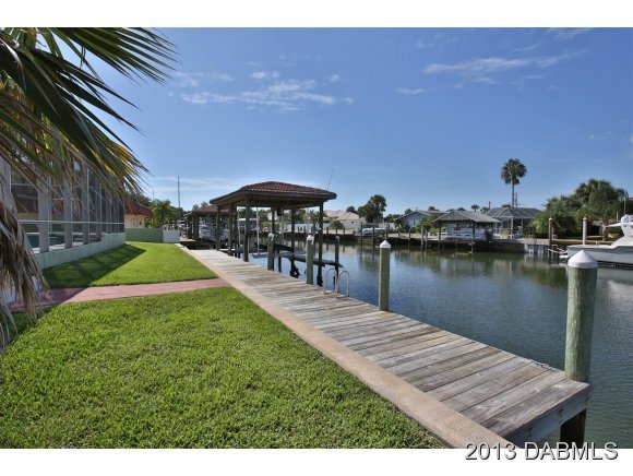 117 Inlet Harbor Road Ponce Inlet, FL 32127 - Photo 23 of 24 a view of a lake with couches and city view