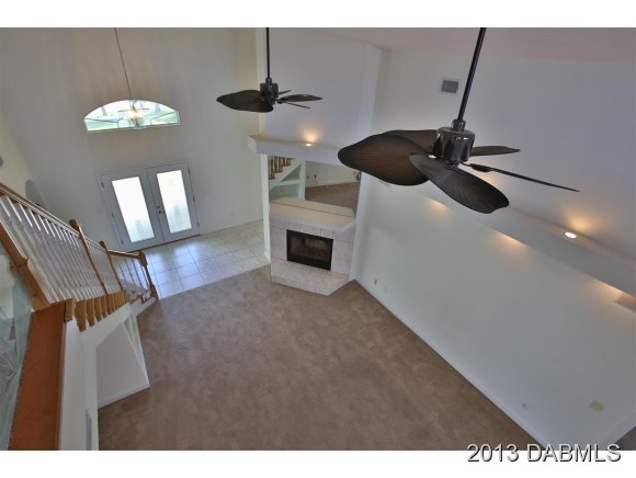 117 Inlet Harbor Road Ponce Inlet, FL 32127 - Photo 7 of 24 a dining room with furniture and chandelier