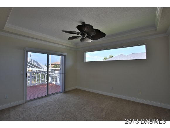 117 Inlet Harbor Road Ponce Inlet, FL 32127 - Photo 8 of 24 a view of room with a ceiling fan