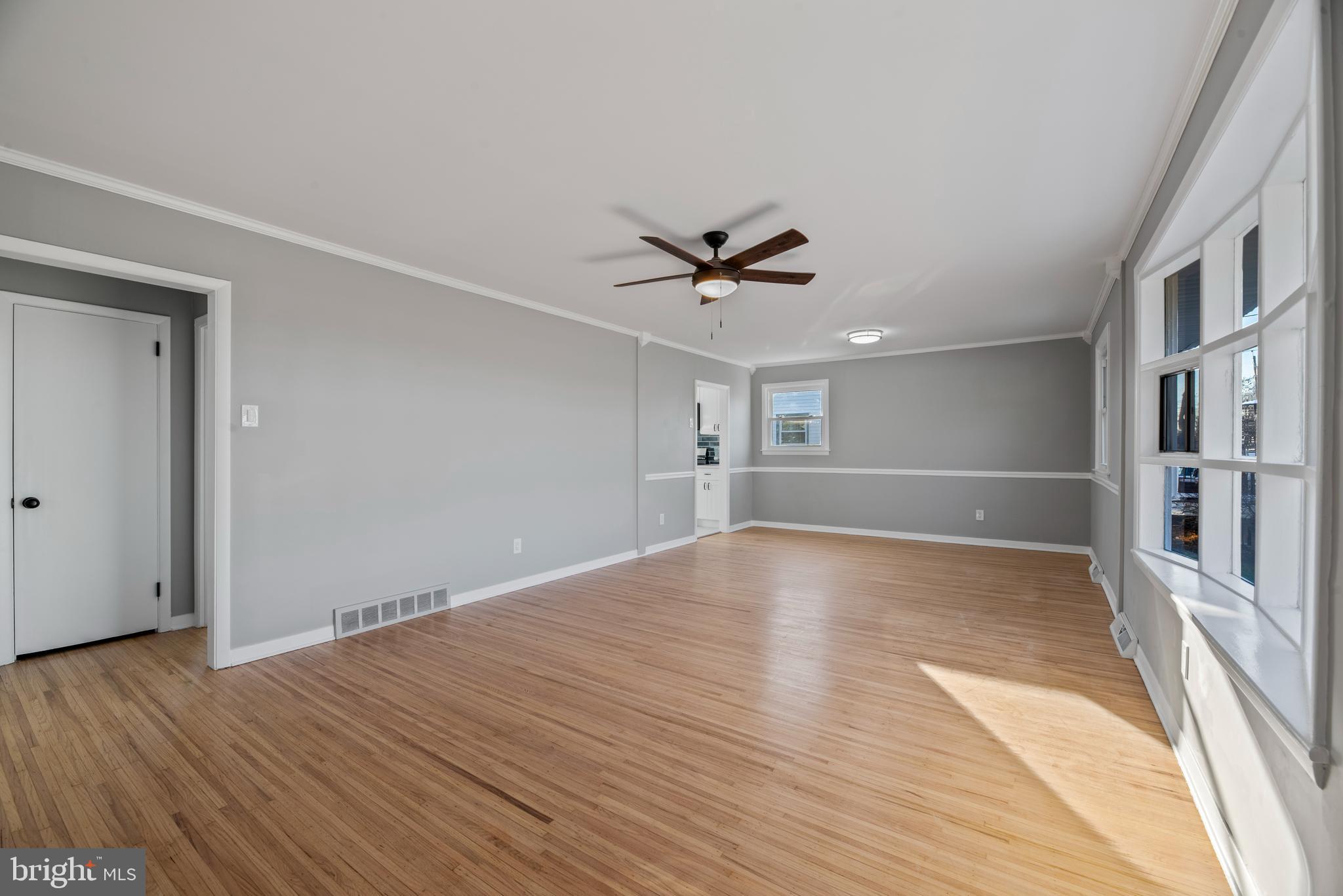 504 River Drive Riverside, NJ 08075 - Photo 4 of 45 a view of empty room with wooden floor and ceiling fan