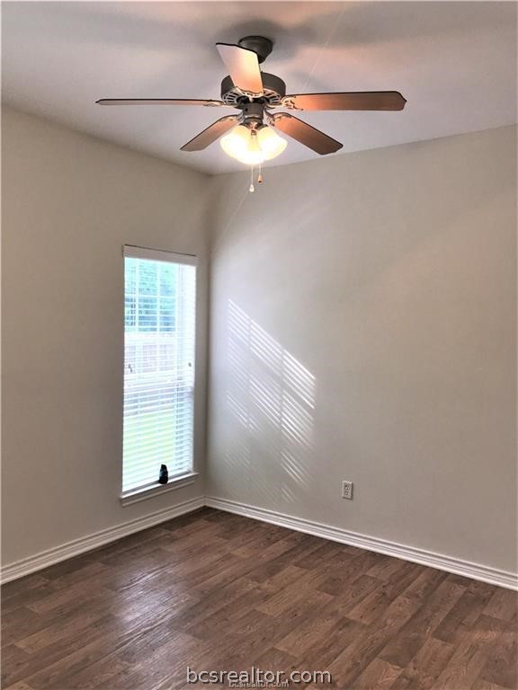 3754 Essen Loop College Station, TX 77845 - Photo 11 of 25 an empty room with wooden floor chandelier fan and windows