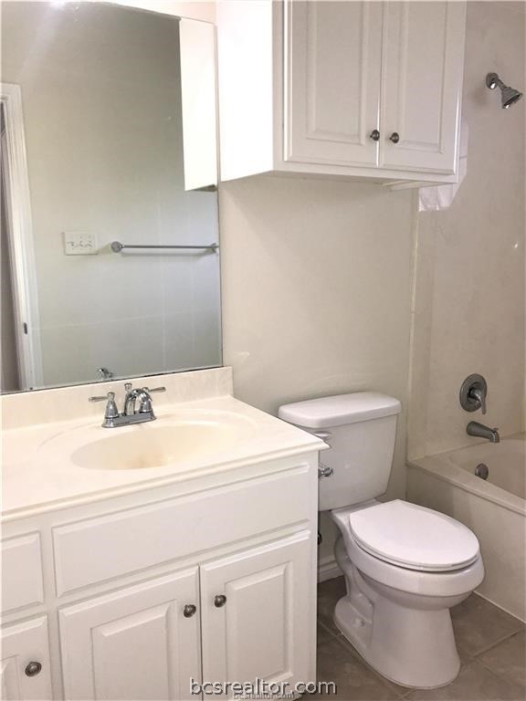 3754 Essen Loop College Station, TX 77845 - Photo 13 of 25 a bathroom with a sink a toilet and vanity