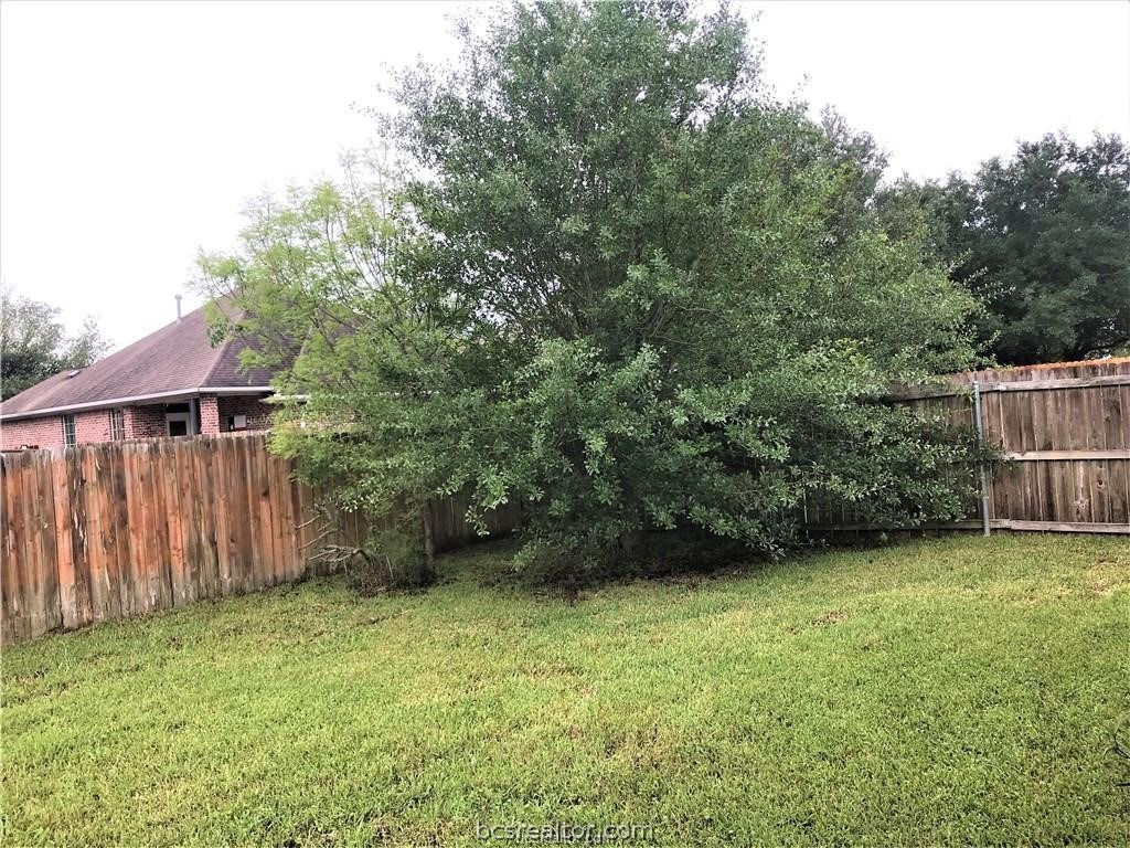 3754 Essen Loop College Station, TX 77845 - Photo 25 of 25 a view of backyard with potted plants and wooden fence
