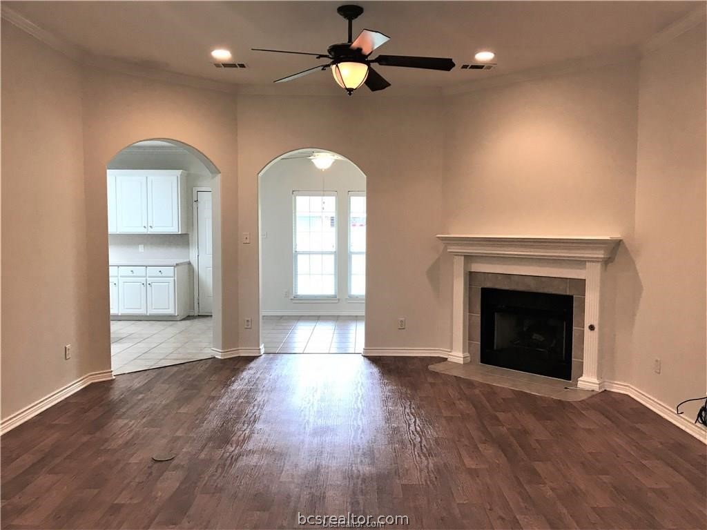 3754 Essen Loop College Station, TX 77845 - Photo 3 of 25 an empty room with windows and fireplace