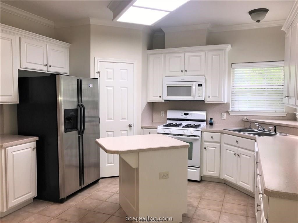 3754 Essen Loop College Station, TX 77845 - Photo 5 of 25 a kitchen with stainless steel appliances granite countertop a stove a refrigerator and a refrigerator