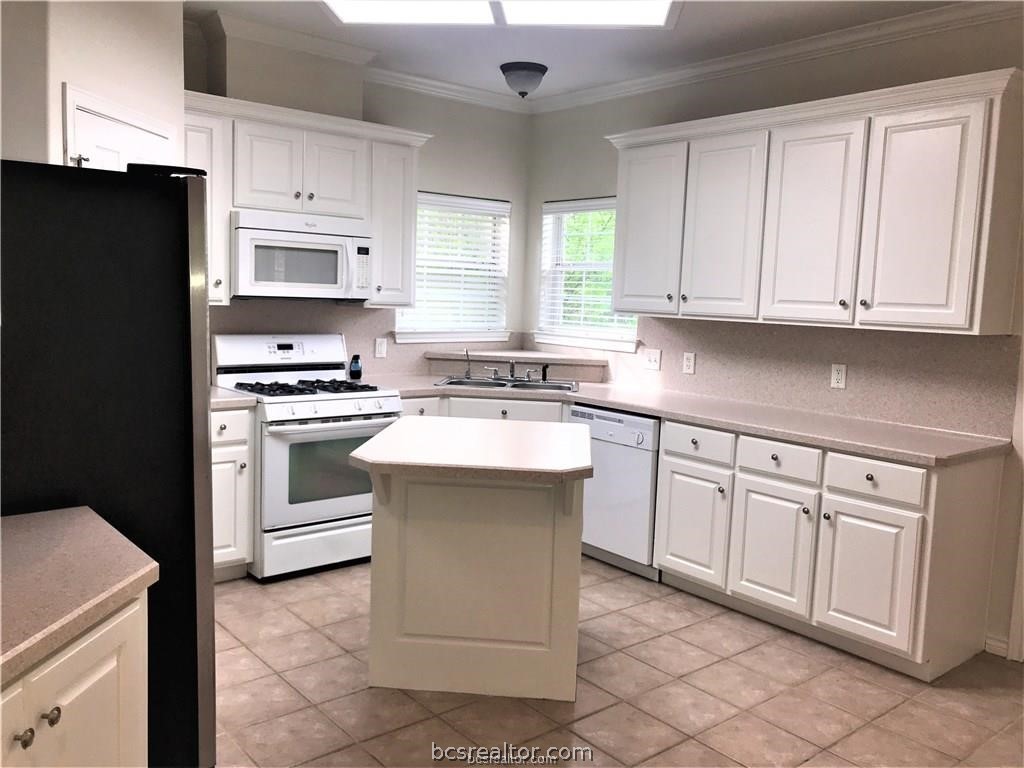 3754 Essen Loop College Station, TX 77845 - Photo 6 of 25 a kitchen with cabinets appliances and a window