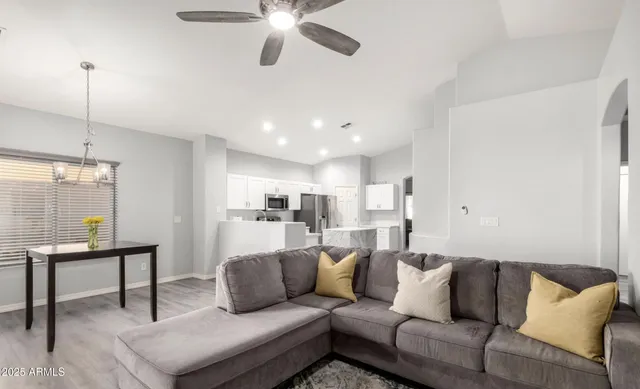 a living room with furniture and a table