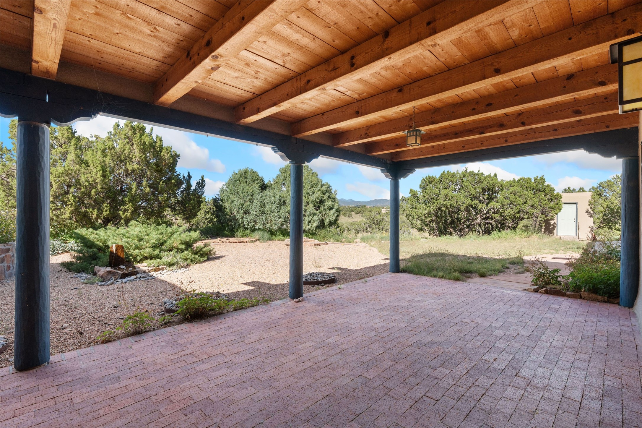 71 Camerada Loop Santa Fe, NM 87508 - Photo 16 of 35 Covered portal off main house