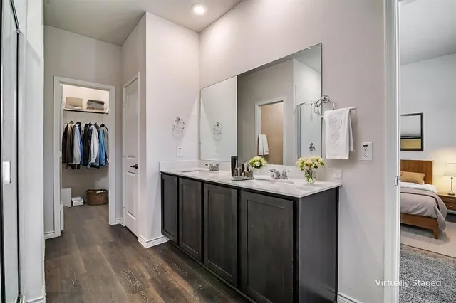 a en suite bathroom with a sink and mirror