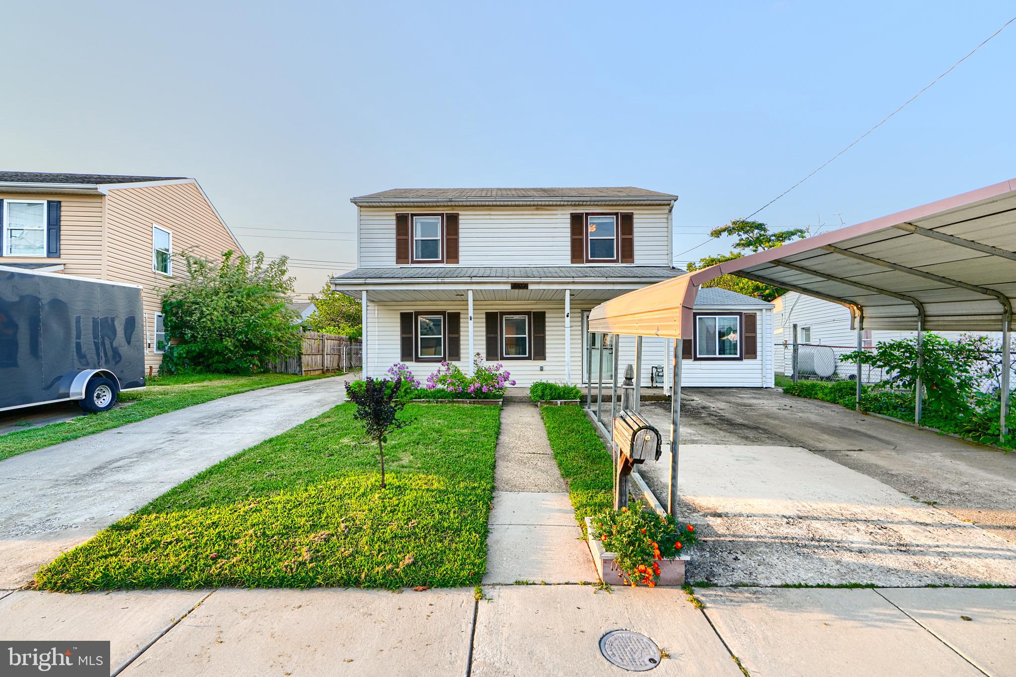 7703 Meath Road Dundalk, MD 21222 - Photo 1 of 45 a front view of a house with garden