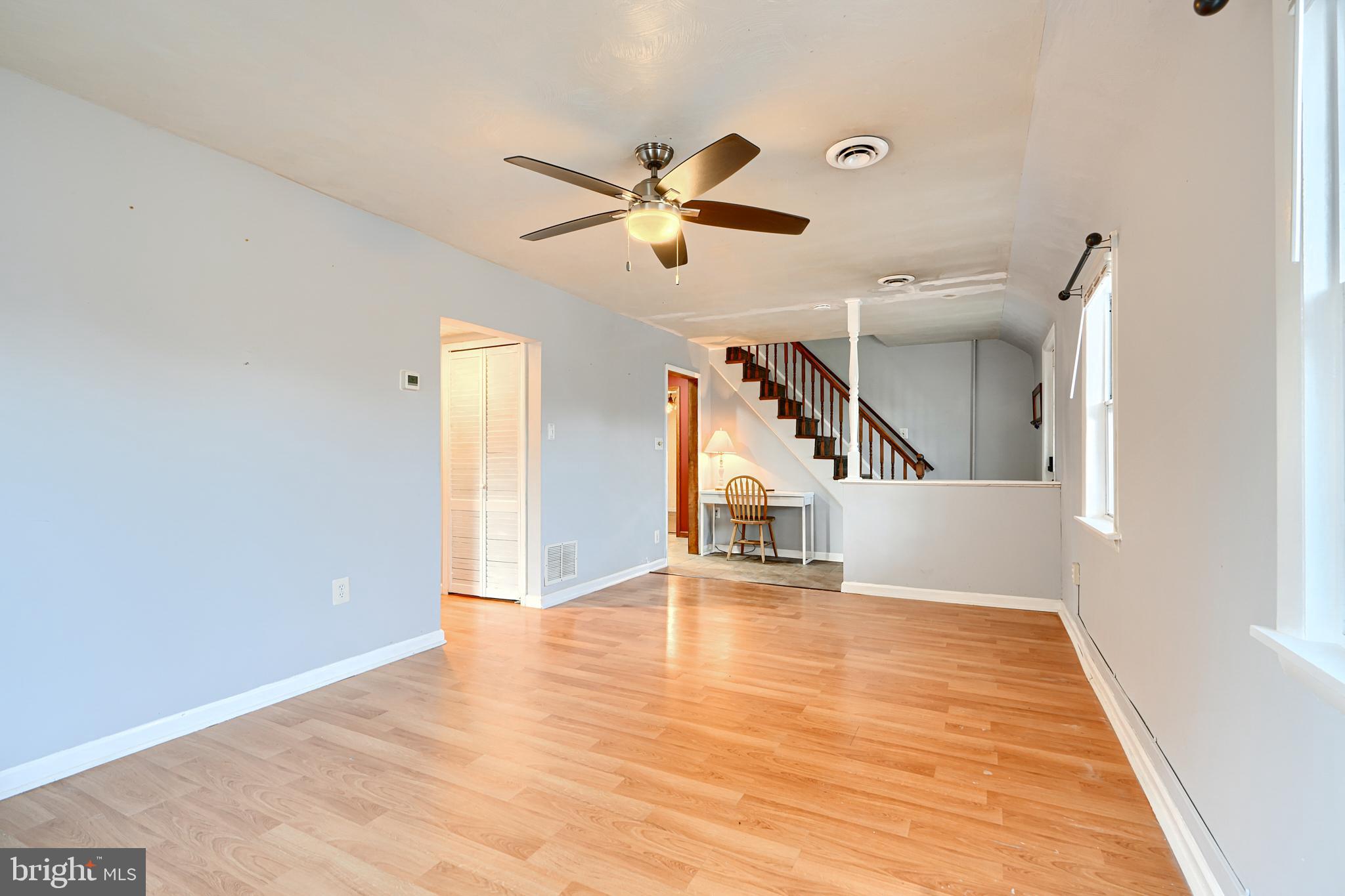 7703 Meath Road Dundalk, MD 21222 - Photo 8 of 45 a view of empty room with wooden floor