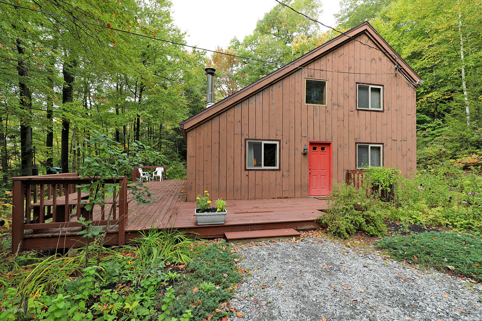 66 Ray Hubbard Road Otis, MA 01029 - Photo 1 of 21 a view of front of house with a yard