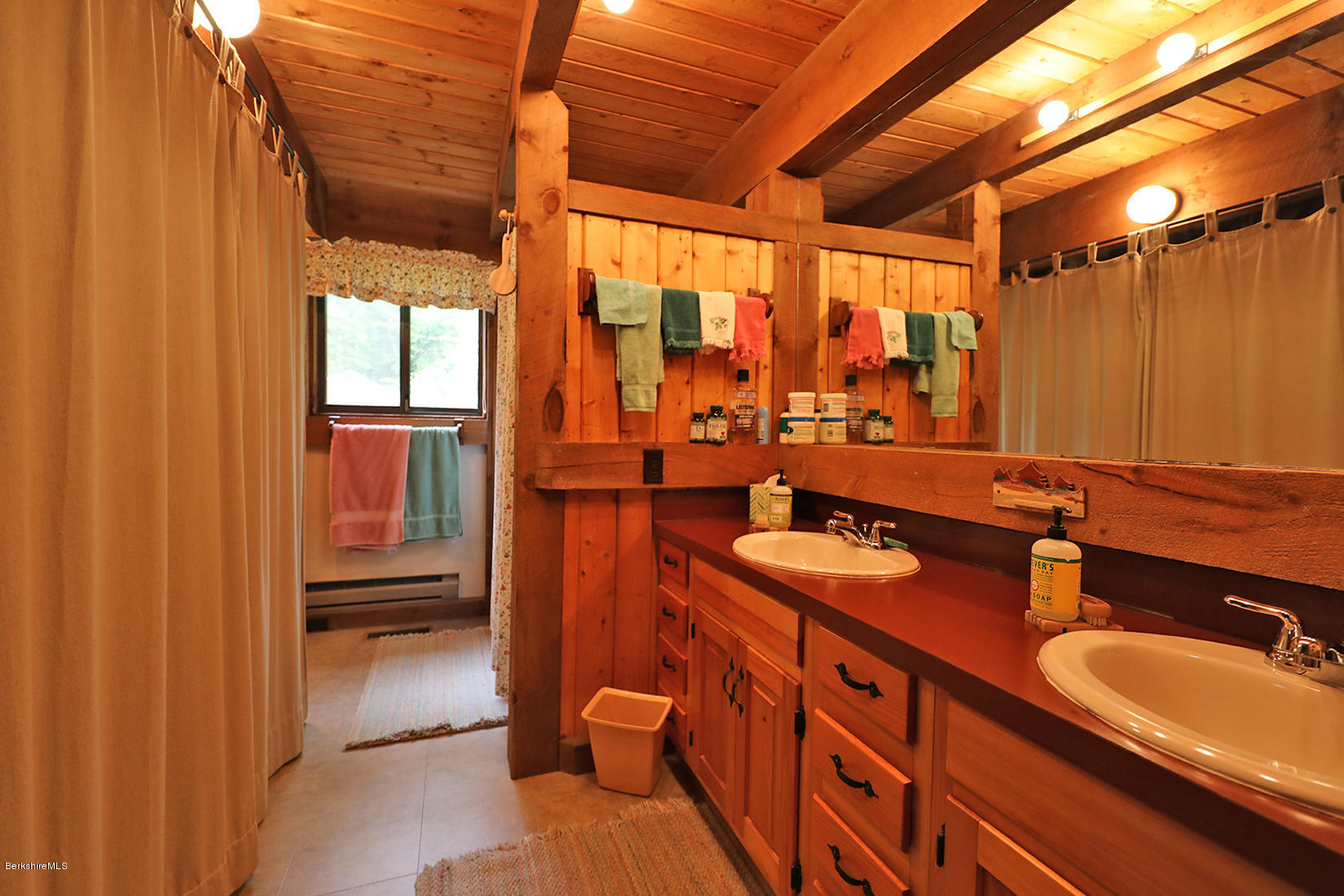 66 Ray Hubbard Road Otis, MA 01029 - Photo 14 of 21 a bathroom with double vanity and a mirror