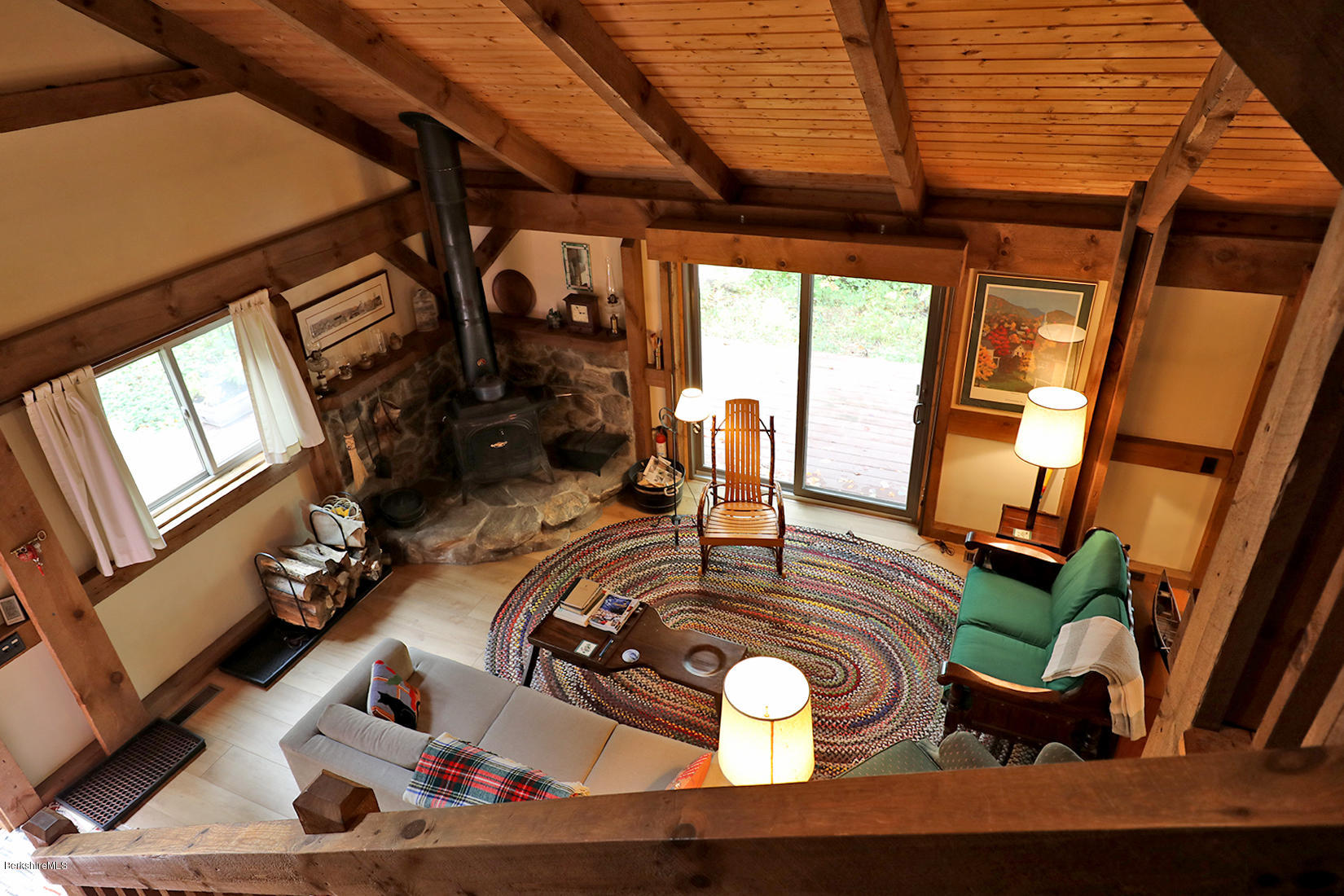 66 Ray Hubbard Road Otis, MA 01029 - Photo 16 of 21 a view of a livingroom with furniture wooden floor and windows