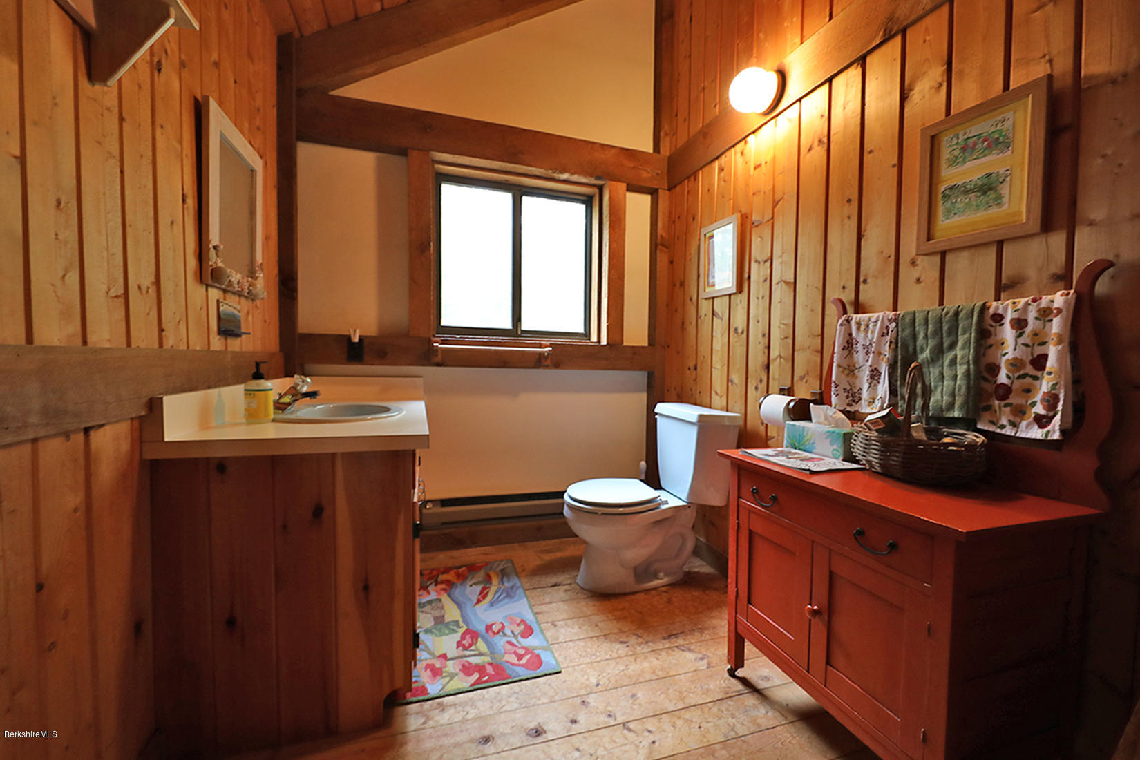 66 Ray Hubbard Road Otis, MA 01029 - Photo 17 of 21 a bathroom with a toilet sink and mirror