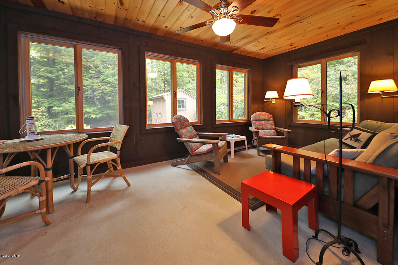 66 Ray Hubbard Road Otis, MA 01029 - Photo 6 of 21 a living room with furniture a table and large windows