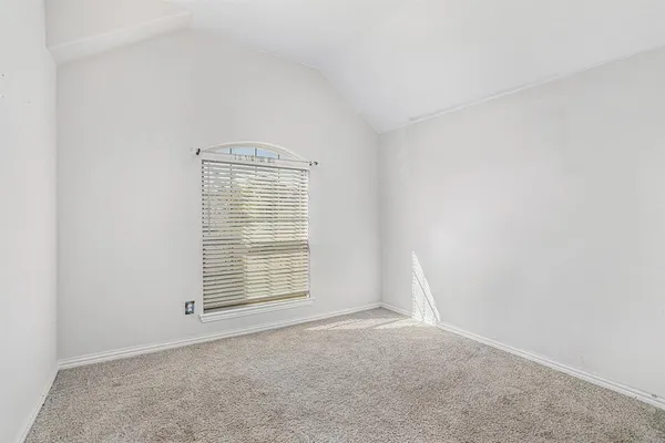 an empty room with closet area