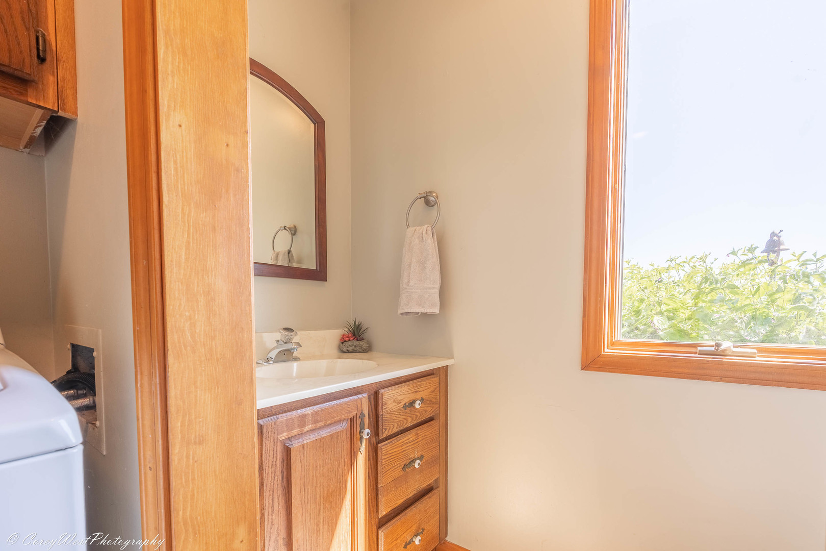 35450 Genoa Road Genoa, IL 60135 - Photo 23 of 41 a bathroom with a sink a mirror and a window