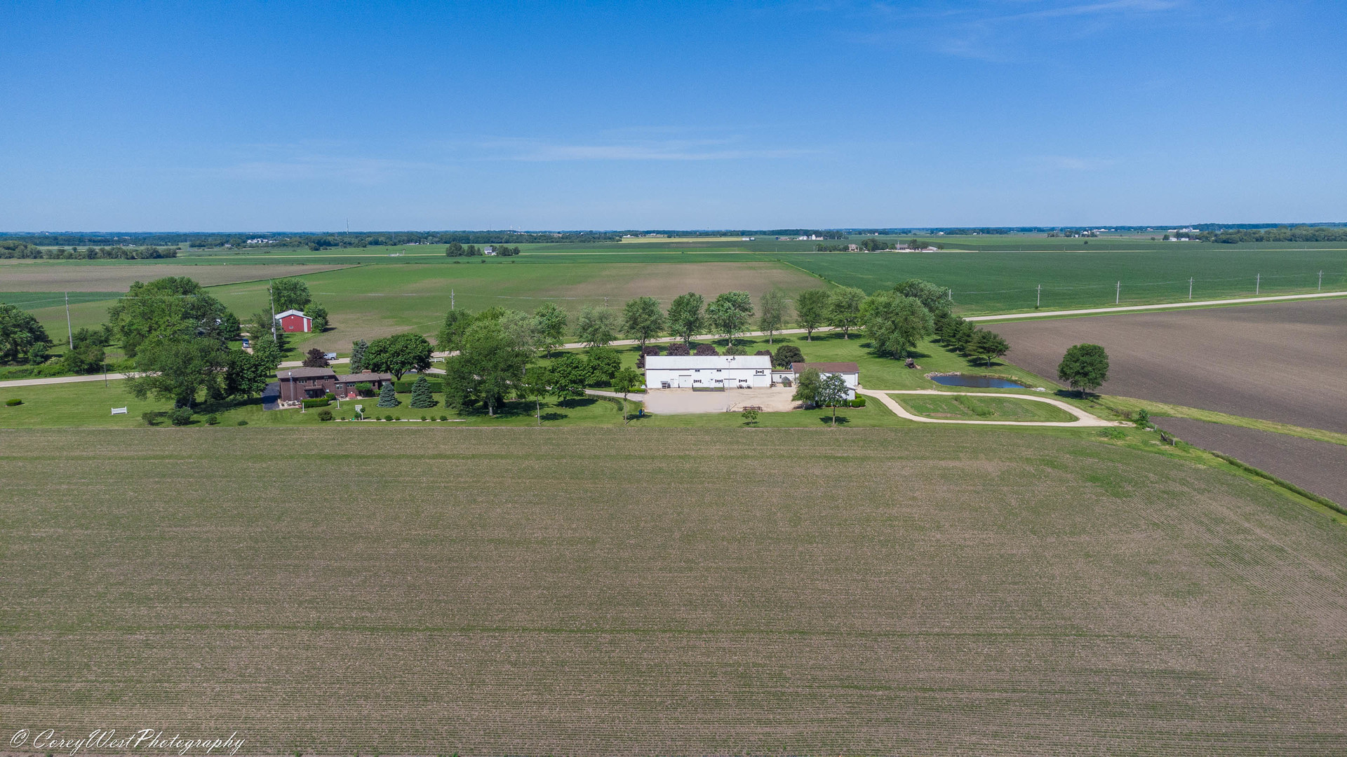 35450 Genoa Road Genoa, IL 60135 - Photo 8 of 41 a view of a lake with houses in the back
