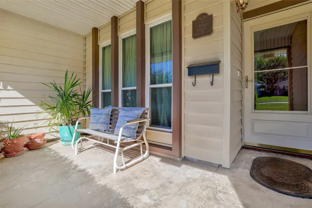 a view of an outdoor space with porch and sitting area
