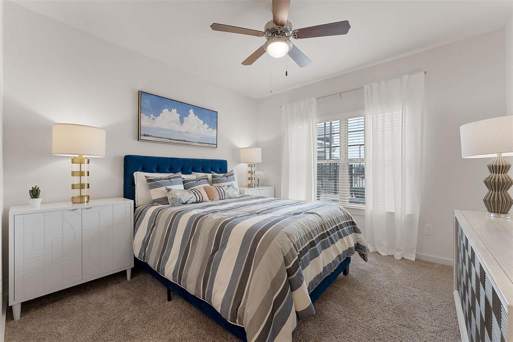 13301 Dessau Road, Unit 7203 Austin, TX 78754 - Photo 4 of 17 a bed room with a bed and a window