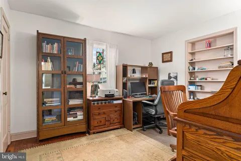 a view of a workspace with furniture and bedroom