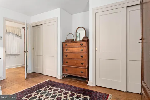 a bedroom with a bed and a table