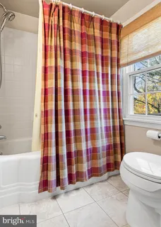 a bathroom with a sink mirror and vanity