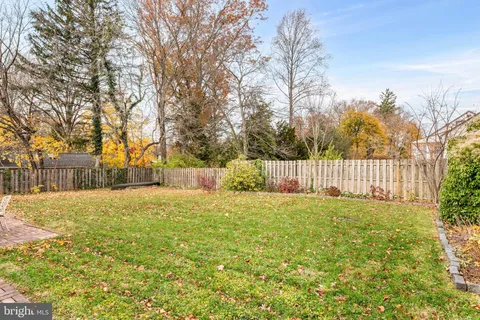 an aerial view of residential building and parking space