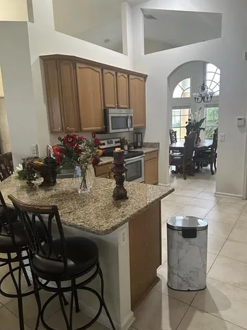 a kitchen with a sink cabinets and microwave