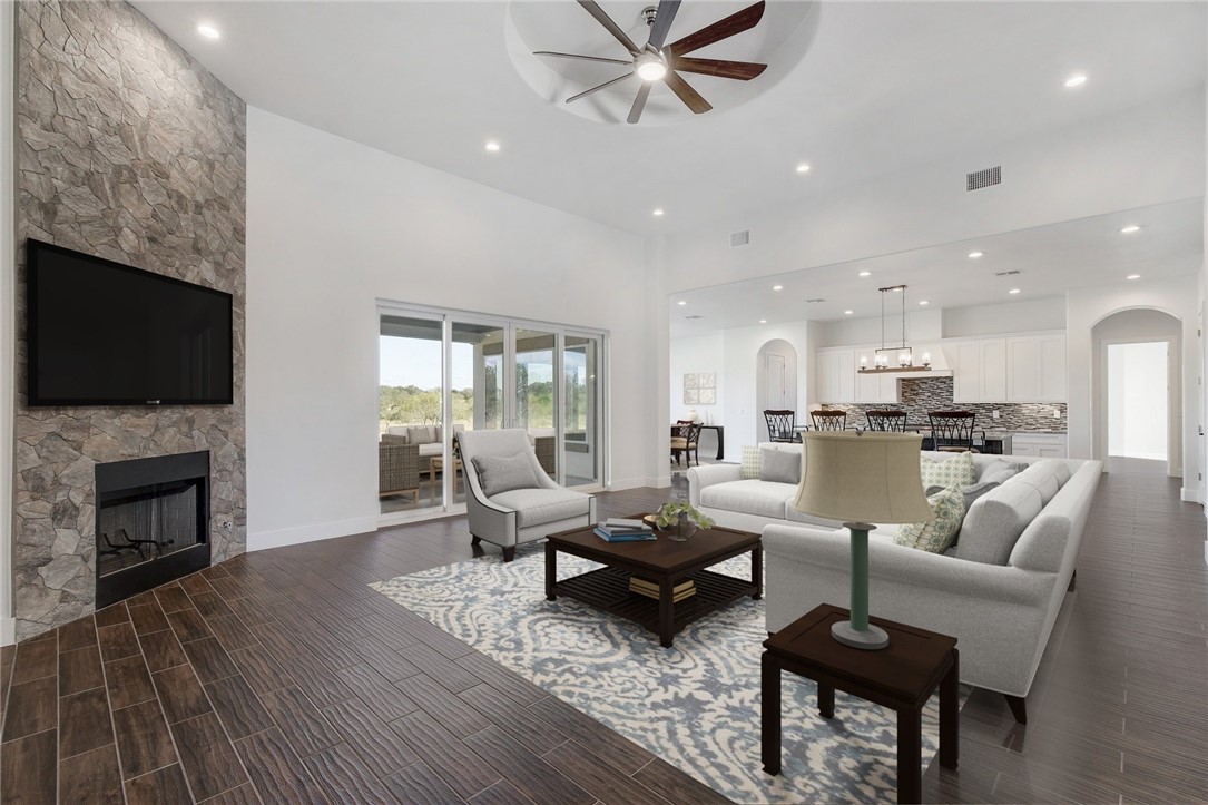 351 Spicewood Trails Drive Spicewood, TX 78669 - Photo 1 of 1 a living room with fireplace furniture and a wooden floor