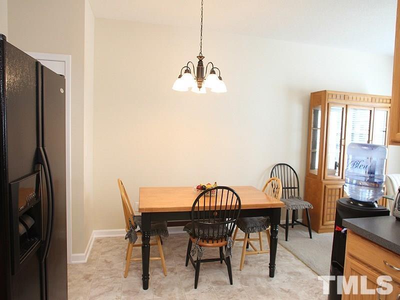 4453 Cardinal Grove Boulevard Raleigh, NC 27616 - Photo 5 of 6 a dining room with furniture and window