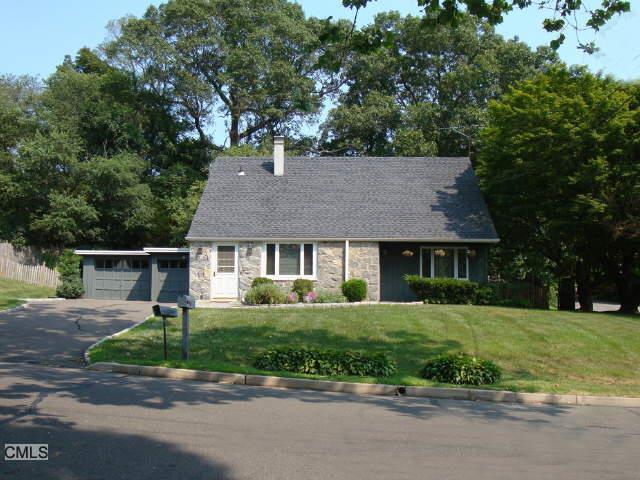 132 Adley Road Fairfield, CT 06825 - Photo 1 of 1 a front view of a house with a yard