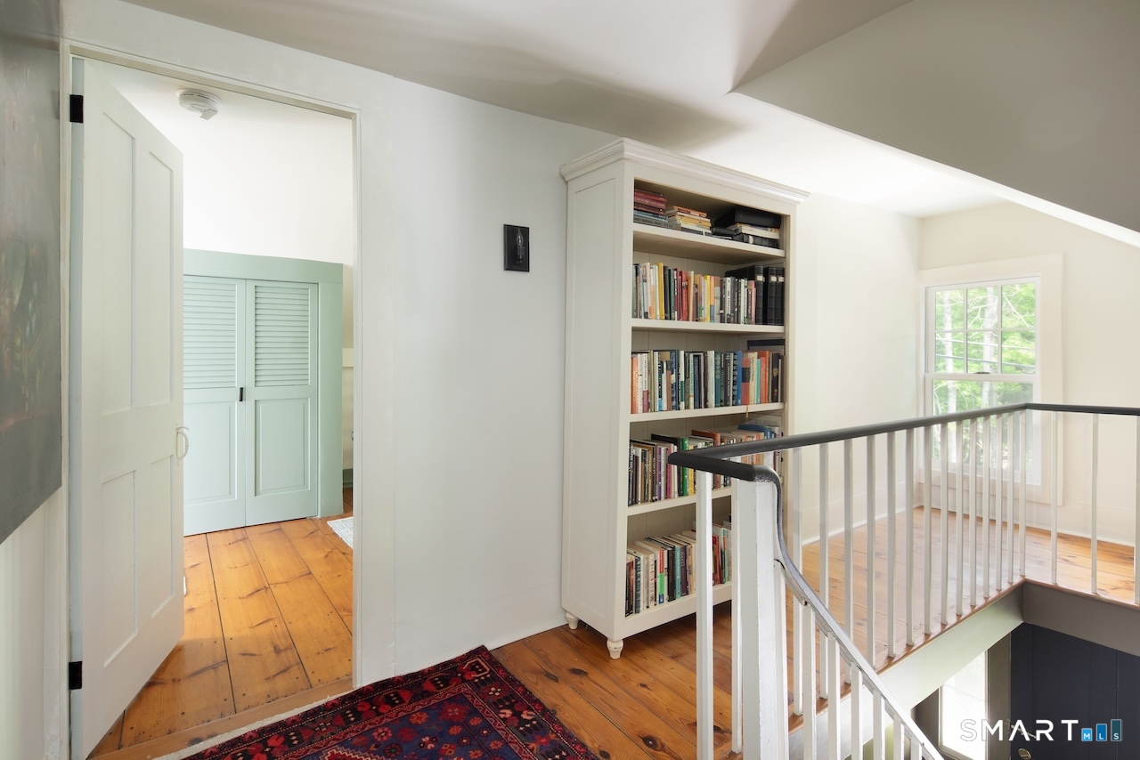 329 Housatonic River Road Salisbury, CT 06031 - Photo 24 of 32 a view of staircase with wooden floor and a window