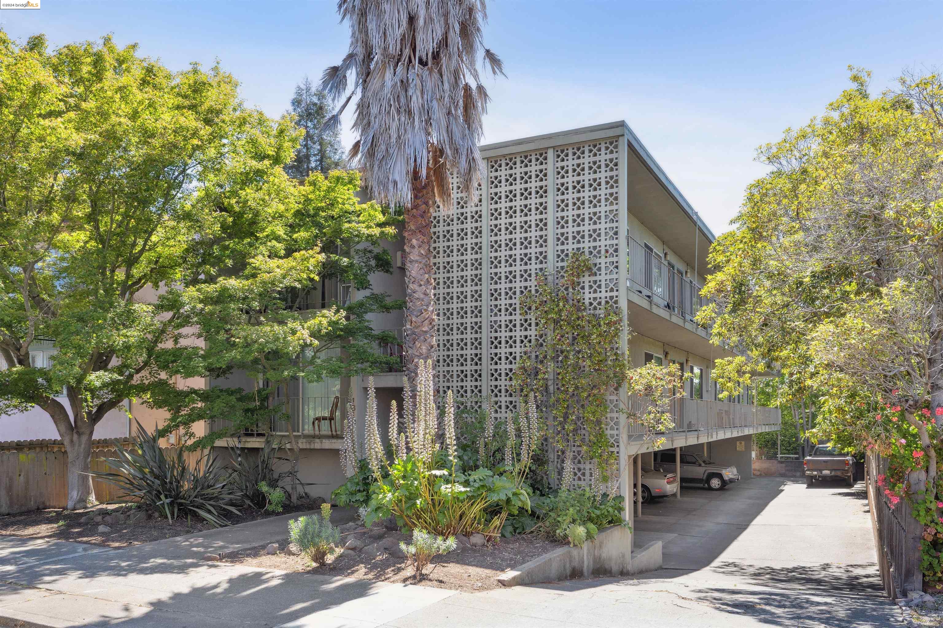 1610 Milvia Street Berkeley, CA 94709 - Photo 1 of 1 a front view of a building with trees