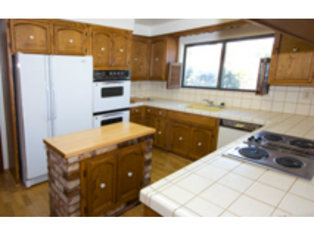 191 Greenbrier Drive Aptos, CA 95003 - Photo 10 of 19 a kitchen with a sink and a stove top oven