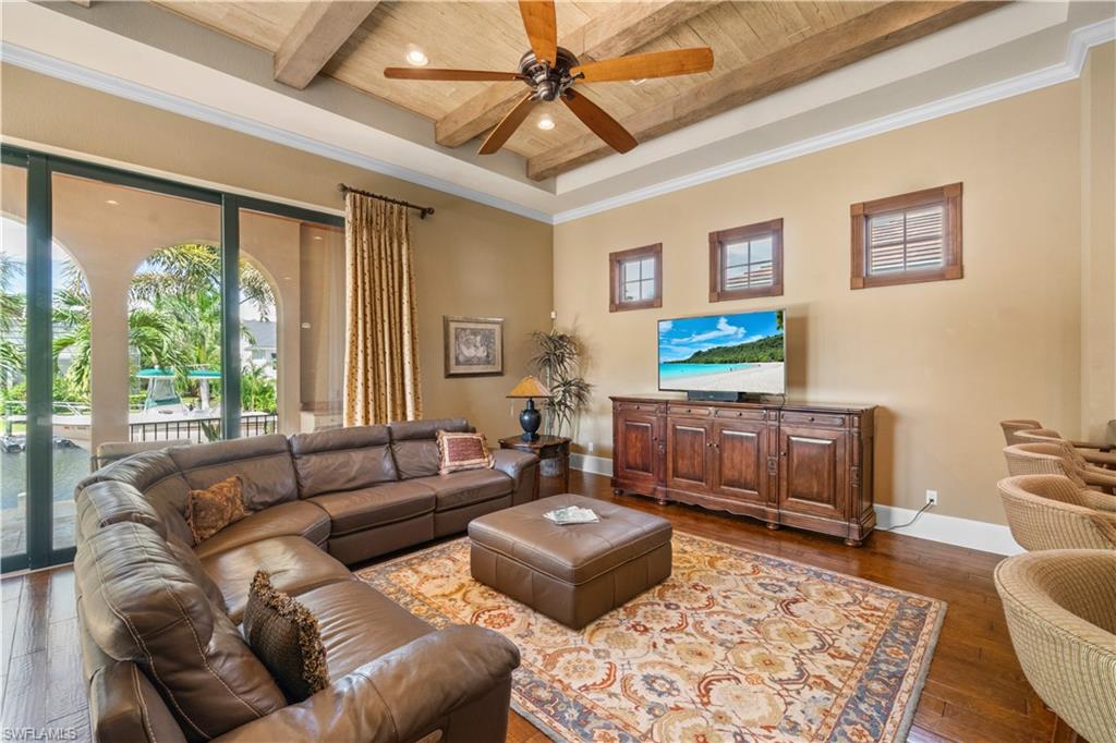 611 18th Avenue South Naples, FL 34102 - Photo 1 of 32 a living room with furniture and a window