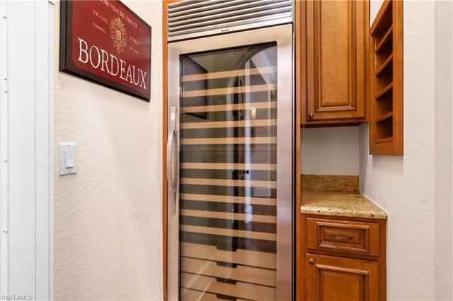 a bedroom with a large bed and a large window