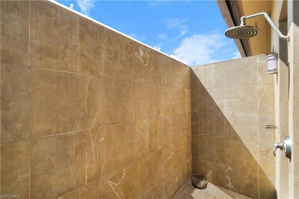 611 18th Avenue South Naples, FL 34102 - Photo 15 of 32 a bathroom with a shower