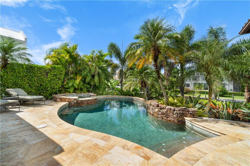 611 18th Avenue South Naples, FL 34102 - Photo 25 of 32 a view of swimming pool outdoor seating and yard