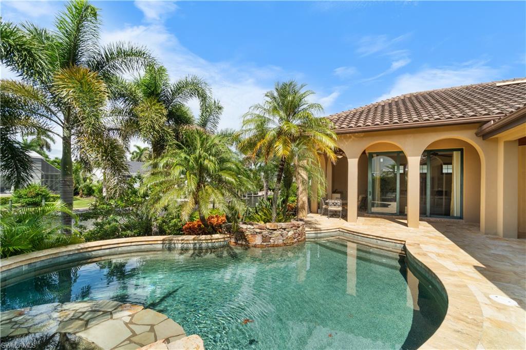 611 18th Avenue South Naples, FL 34102 - Photo 28 of 32 a swimming pool with outdoor seating yard and barbeque oven