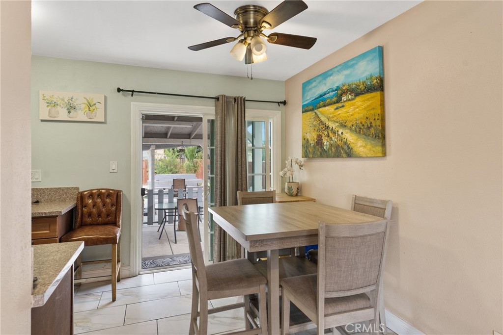 276 East Merrill Avenue Rialto, CA 92376 - Photo 11 of 35 a view of a dining room with furniture and a chandelier