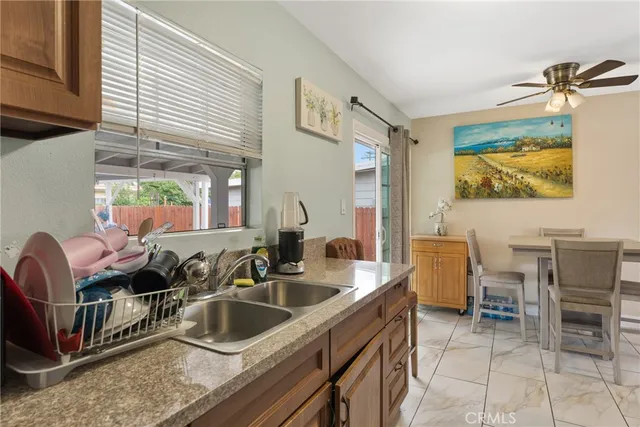 a kitchen that has a sink and a large window