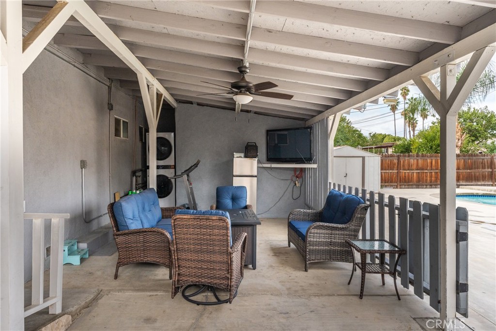 276 East Merrill Avenue Rialto, CA 92376 - Photo 19 of 35 a living room with furniture a ceiling fan and a rug