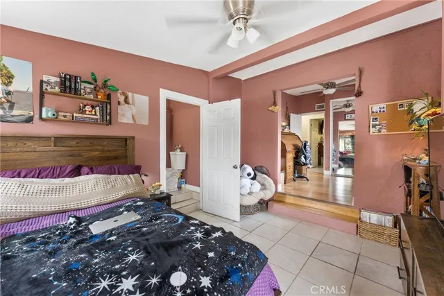 a bedroom with a bed and a couch